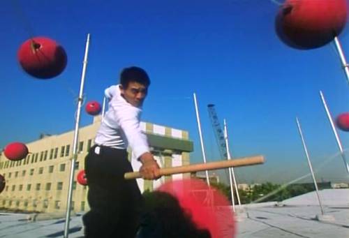 Jet (Jet Li Lian Jie) demonstrates the red rubber balls.