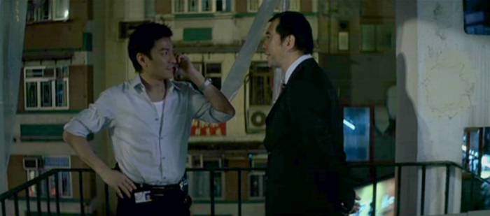 Lau (Andy Lau Tak Wah) calling Sam right underneath Wong's (Anthony Wong Chau-Sang) nose